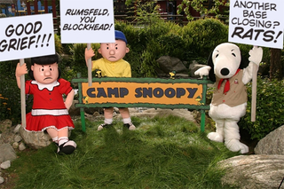 Camp Snoopy characters outfitted with signs protesting the closure.